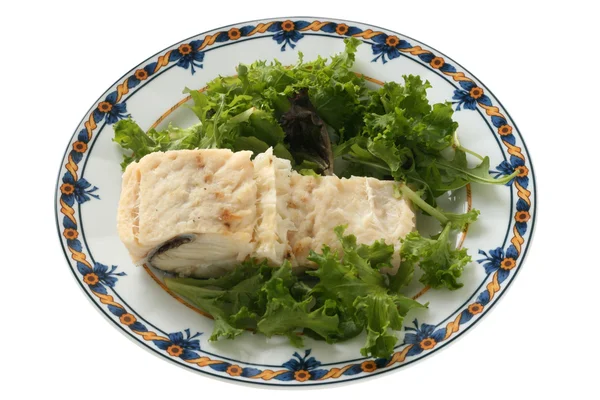 stock image Boiled codfish with salad