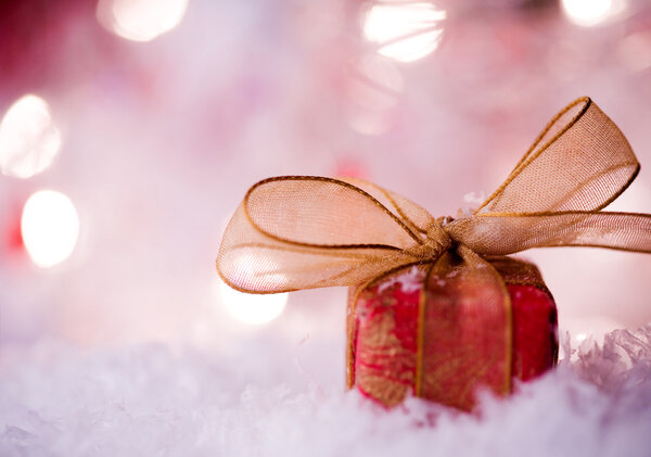 Red christmas gift with beautiful golden ribbon