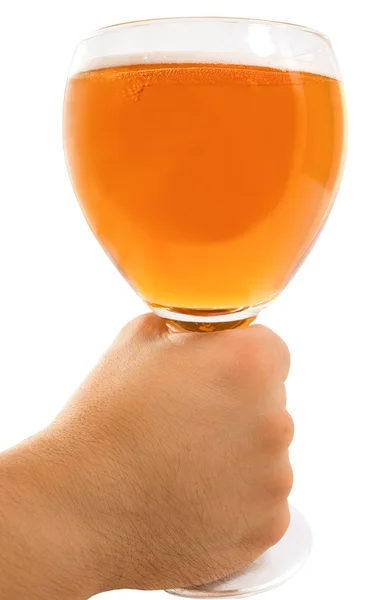 Man 's Hand Holding up a Glass of Beer Leffe — стоковое фото