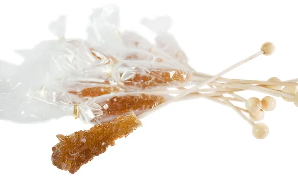 Beyaz izole kahverengi taş şeker şeker — Stok fotoğraf