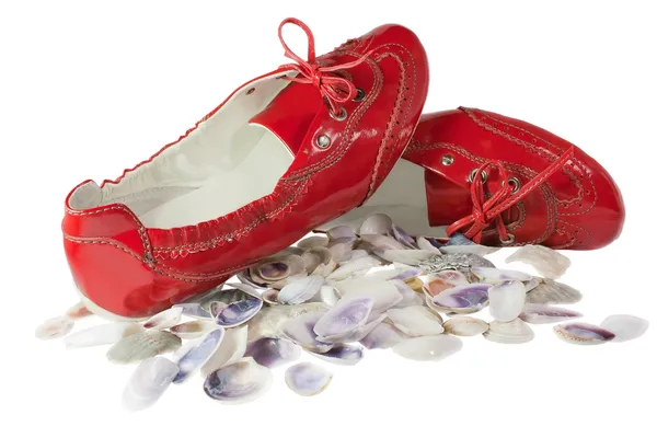 Red lady ballet flat shoes and seashells isolated on white — Stock Photo, Image