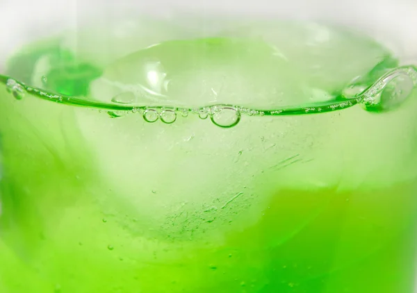 Close up of green cocktail with ice cubes — Stock Photo, Image