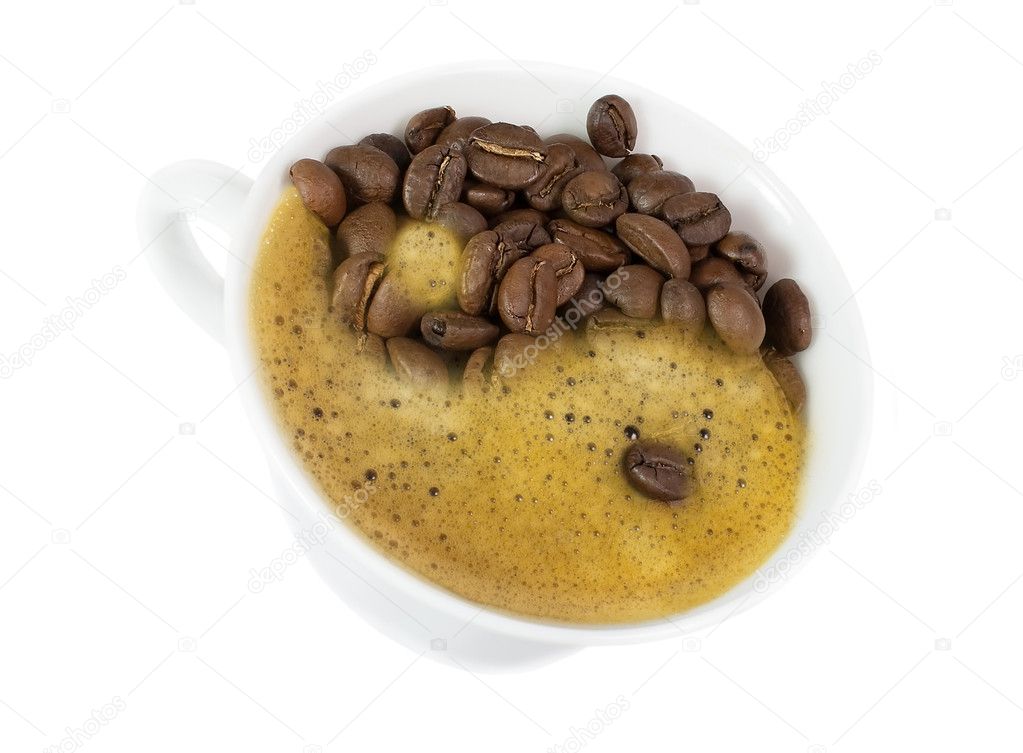 Yin and Yang in a cup of coffee isolated on white