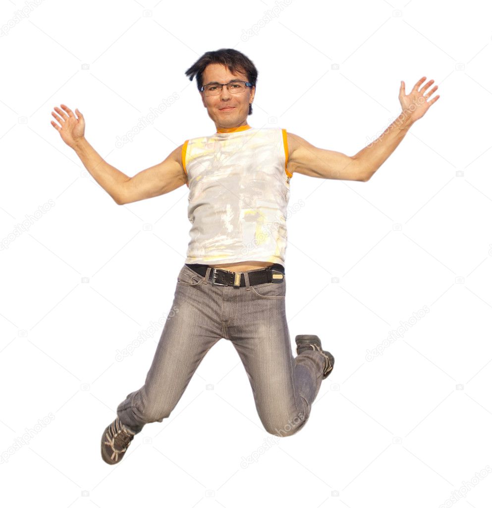 Happy young man jumping in air isolated
