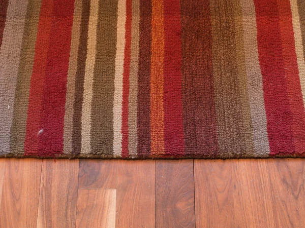 Carpet on a Wood Floor — Stock Photo, Image