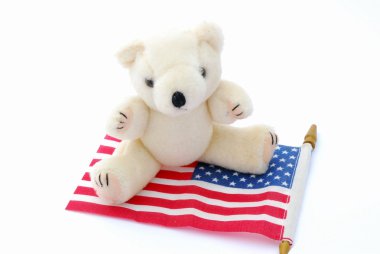 Teddy bear on USA flag clipart