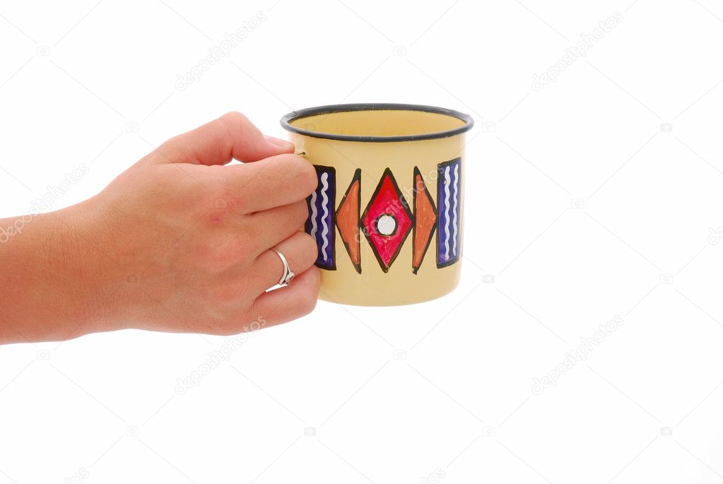 Hand with African coffee cup