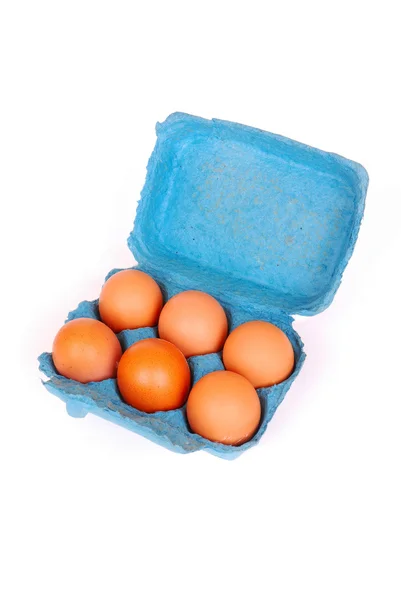 Caixa azul com ovos — Fotografia de Stock