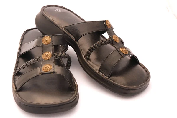 Svarta sandalerčerné sandály — Stock fotografie