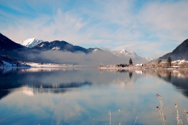 Mountain lake in Alps with scenic reflection clipart