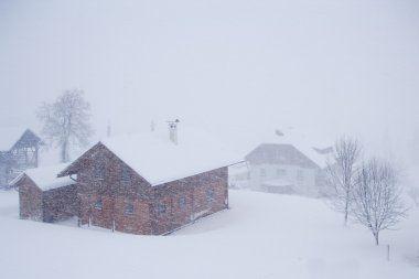 Alpine village in the snow clipart