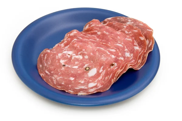 Sopressa salami na płytce niebieski — Zdjęcie stockowe