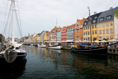 Copenhagen, Denmark - colorful buildings of Nyhavn street clipart