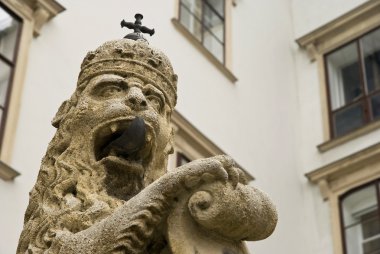 Lion statue at palace Hofburg clipart