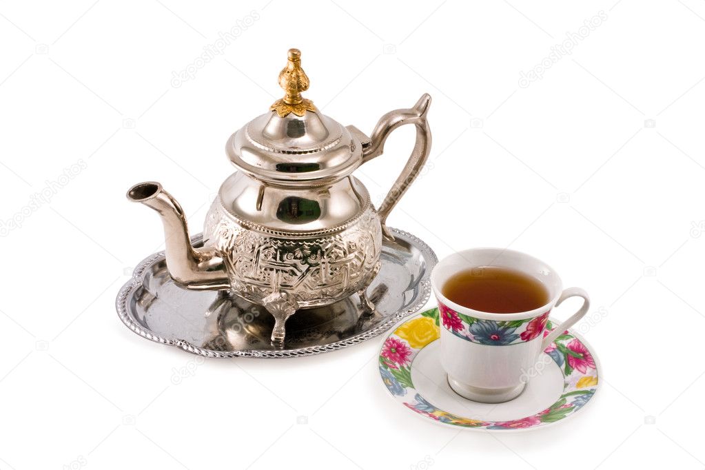 Ancient silver teapot and cup to tea
