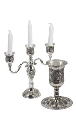 Silver kiddush wine cup and candlestick clipart