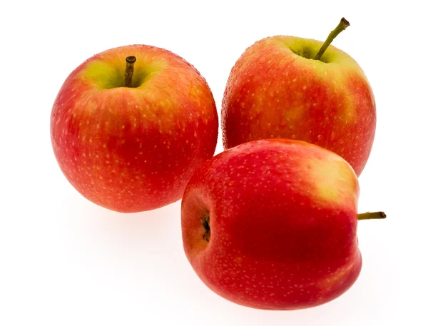 Három piros érett alma, fehér háttér — Stock Fotó