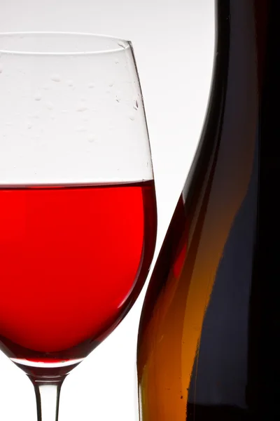 Jet of red wine current in a glass — Stock Photo, Image