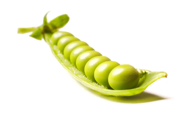 stock image Green peas isolated on white