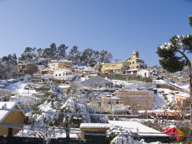 Snow covered town in Barcelona clipart