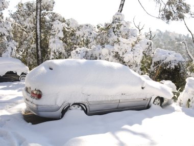 Snow covered car clipart