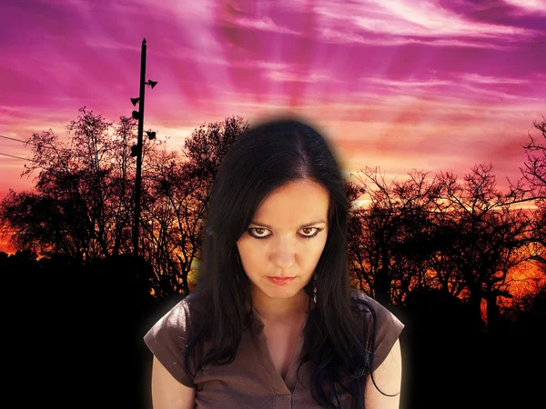 Angry young woman at the dusk — Stock Photo, Image