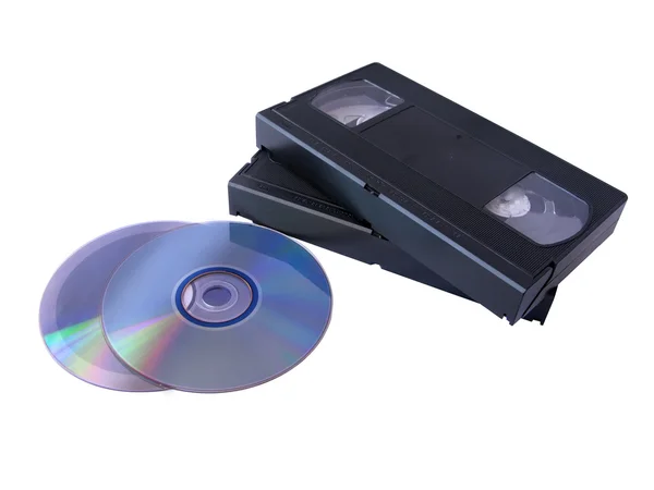 Αποθήκευση μέσων: δύο Dvd και δύο κασέτες Vhs. Παλαιά έναντι νέας τεχνολογίας — Φωτογραφία Αρχείου