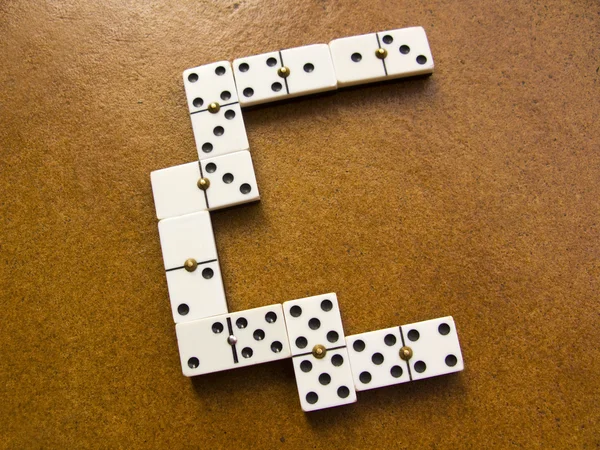 White domino pieces in rusty brown background — Stock Photo, Image