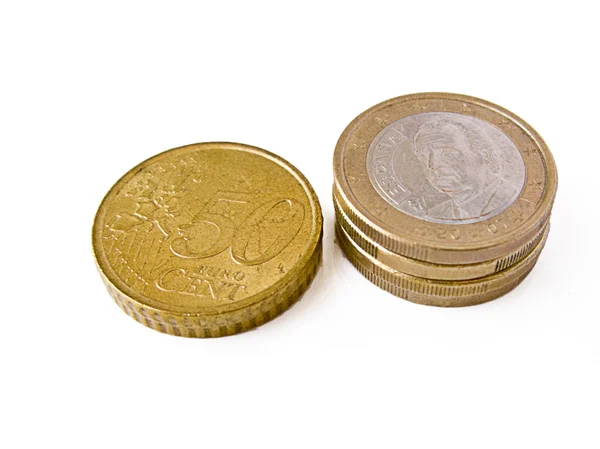 Pilas de monedas de euro aisladas en blanco — Foto de Stock