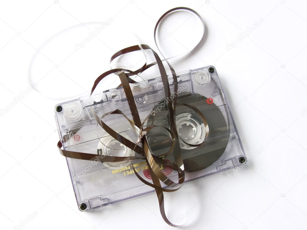 An old damaged cassette tape, isolated in white