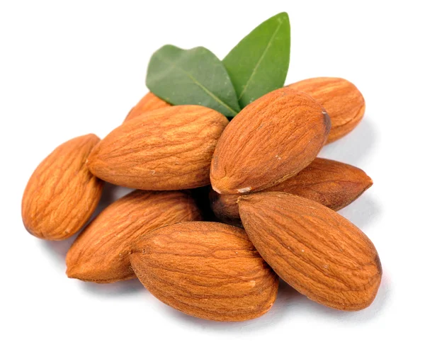 Group of almond nuts with leaves — Stock Photo, Image