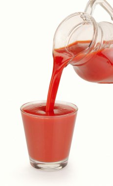 Tomato juice is poured clipart