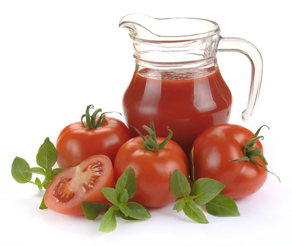 Jug, glass of tomato juice and fruits — Stock Photo, Image
