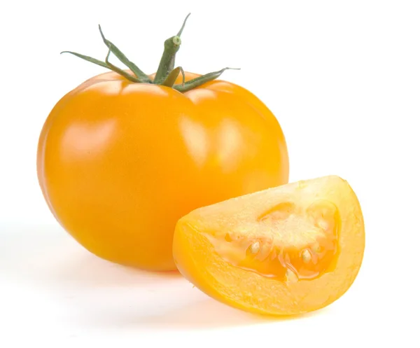 Yellow tomato with slices — Stock Photo, Image