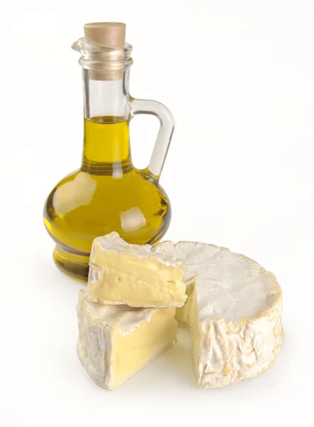 Olive oil and Camembert cheese — Stock Photo, Image