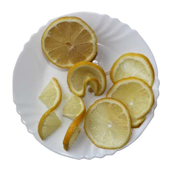 Лимоны на тарелке — стоковое фото