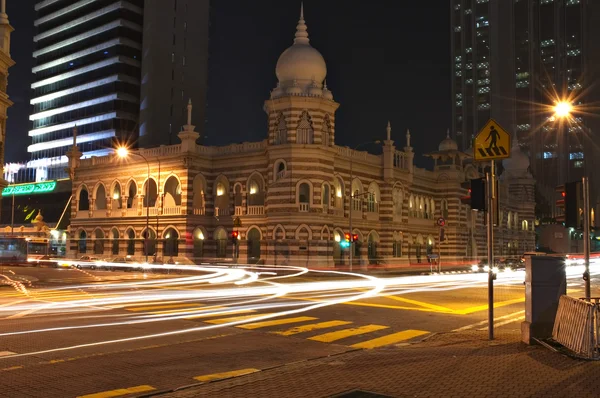 stock image Night scene at a busy road intersection in Kuala Lumpur, Malaysia, with car