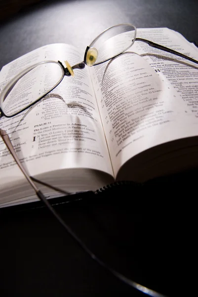 Bible opened with reading glasses — Stock Photo, Image