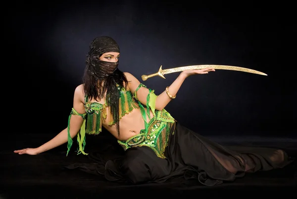 Belly dancer with saber — Stock Photo, Image