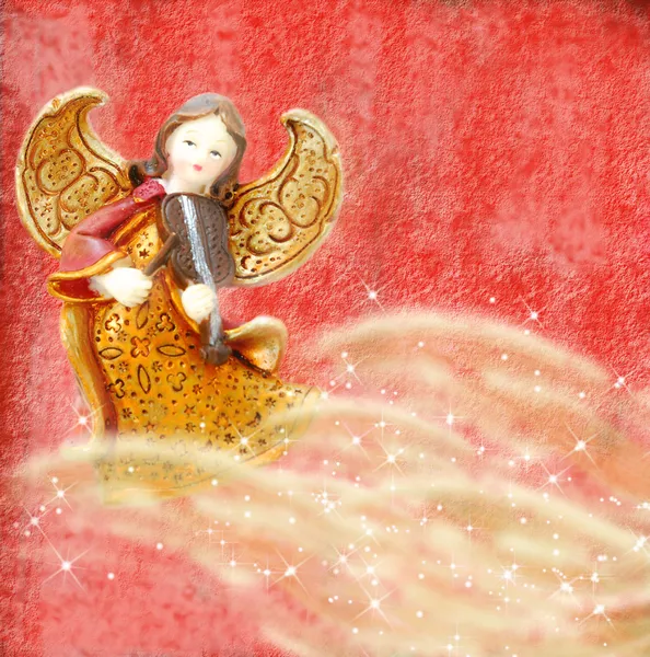 Angel with violin on red background — Stock Photo, Image