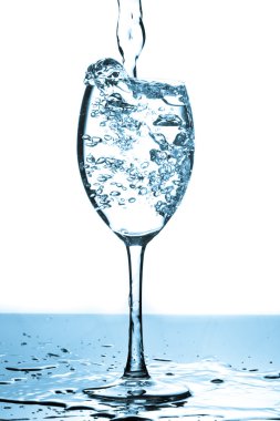 Refreshing water bubbles in a glass clipart