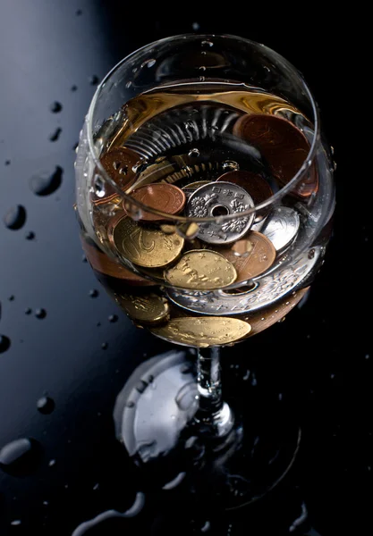 Coins in a glass — Stock Photo, Image