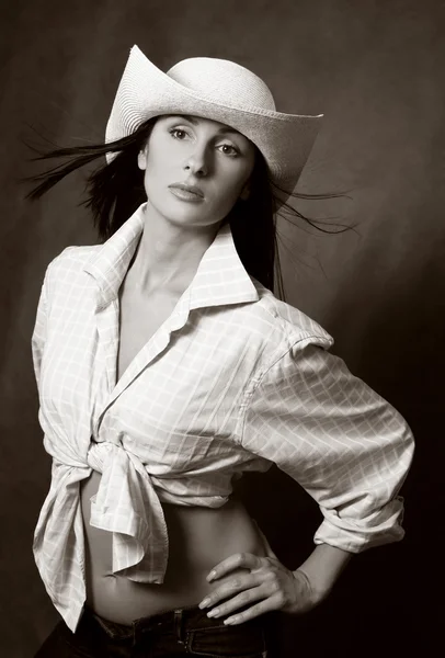 Beautiful brunette in hat — Stock Photo, Image