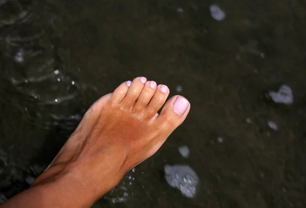Sunburnt жіночих ніг — стокове фото