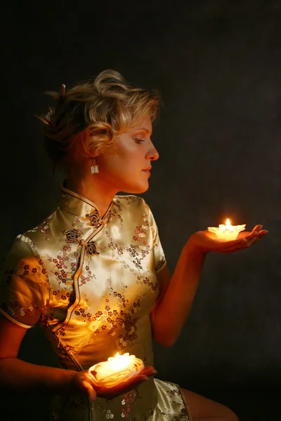 Blonde with candles — Stock Photo, Image