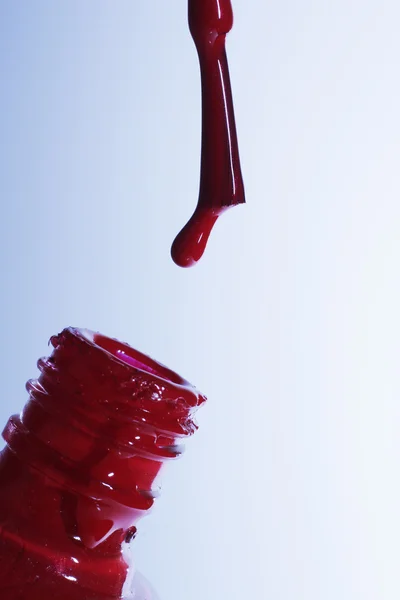 Brush with a red paint — Stockfoto