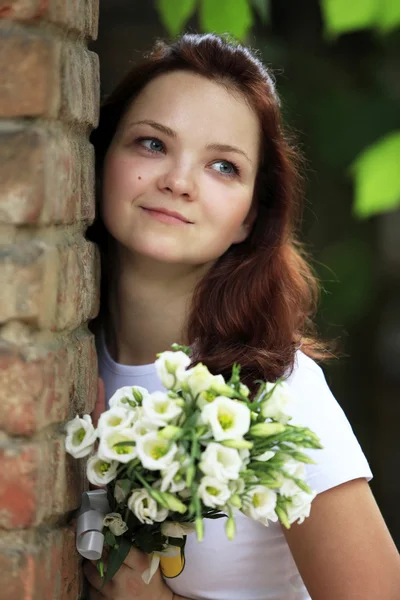 The girl with a bouquet — Stock Photo, Image