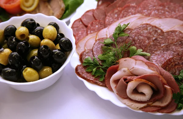 Olives and sausage — Stock Photo, Image