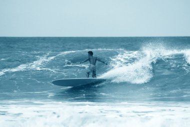 Surfer in ocean clipart