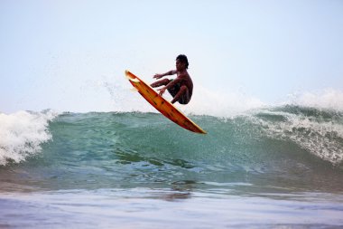 Surfer in ocean clipart